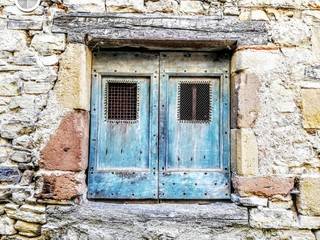 old window in stone wall