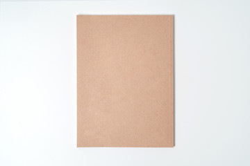 Fototapeta premium Brown spiral notebook isolated on white background.top view