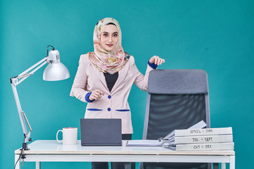 Office Lady with bundle of file on the table and laptop