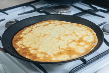 cooking in the kitchen, cooking pancakes in a pan, top view