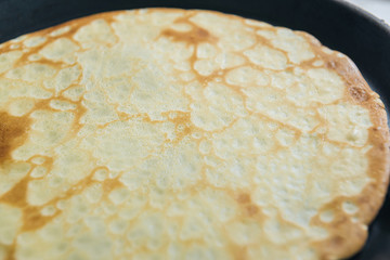 cooking in the kitchen, cooking pancakes in a pan, close-up view from above