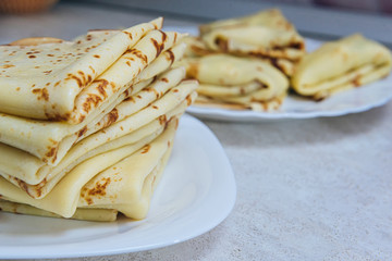 ready-made pancakes in a plate close-up