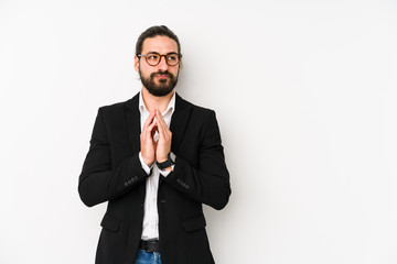 Young caucasian business man isolated on a white background making up plan in mind, setting up an idea.