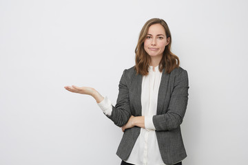 Businesswoman is holding her palm up presenting 