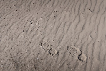 beach light sand with footprints