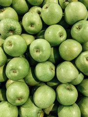 lots of ripe delicious sweet apples to eat like a background