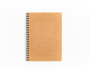 Brown spiral notebook isolated on white background.top view