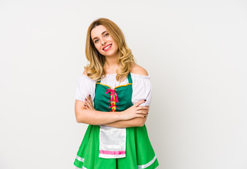 Fototapeta premium Young woman wearing a saint patricks day clothes isolated laughing and having fun.