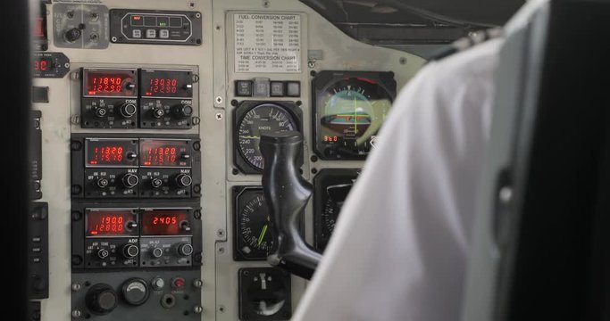 Pilot flying a plane with open cockpit, aircraft and instrument board slightly shaking