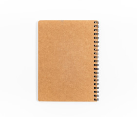 Brown spiral notebook isolated on white background.top view
