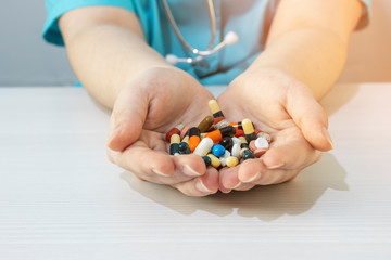 A doctor holds pills