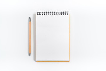 Brown spiral notebook isolated on white background.top view