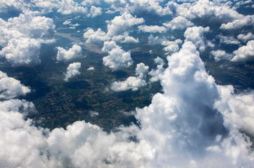 Naklejka na ściany i meble View of beautiful heaven cloudscape from flying plane window.