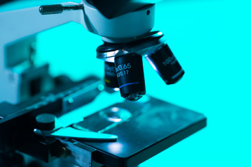 Close-up of scientific microscope. Laboratory in hospital. Epidemic disease, healthcare, vaccine research and coronavirus covid-19 test.
