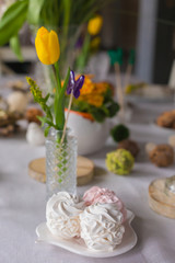 Easter festive spring table setting decoration, marshmallows, selective focus, toned, top view