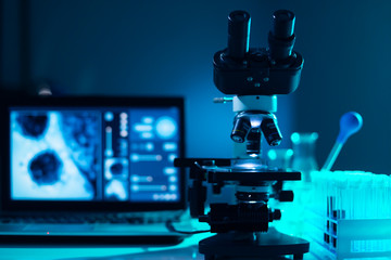 Close-up of scientific microscope. Laboratory in hospital. Epidemic disease, healthcare, vaccine...