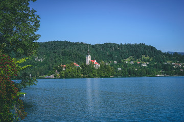 Fototapeta premium Beautiful view over Bled lake and church in Slovenia