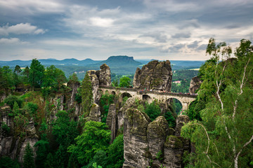 Fototapeta premium Famous bridge Basteibruecke in Saxon Switzerland on a cloudy day