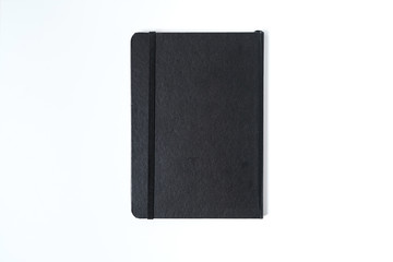 black notebook on white background with clipping path