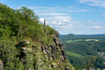 Naklejka premium An obelisk at the mountain Lilienstein in the Saxon Switzerland