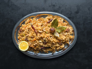 Vegetable Biryani, Vegetarian dish on a black table. Top view