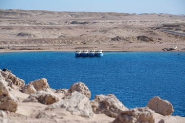 Fototapeta premium Boats in Red Sea near coast of Sharm El Sheikh city, Egypt
