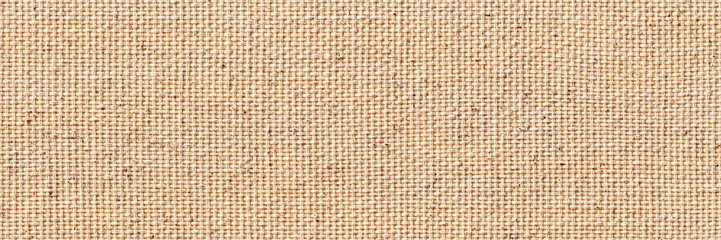 Blank, uncoated canvas or scrim for painting. Long and wide panoramic banner background from rough linen beige cloth or burlap.