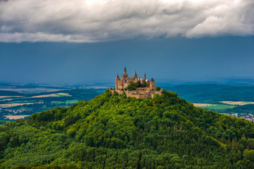 Fototapeta na wymiar Castle Hohenzollern, seat of the imperial house of Hohenzollern under thick clouds