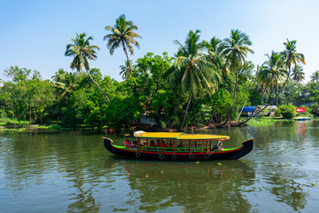 Fototapeta na wymiar Alapphuzza, Kerala, India - December 25 2019 - A colorful Houseboat