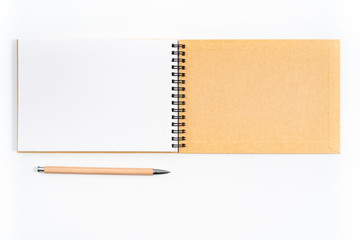 Brown spiral notebook isolated on white background.top view