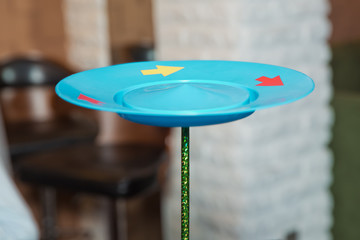 Fun with Spinning Plates .balancing a spinning plate. A collection of spinning pink plates .