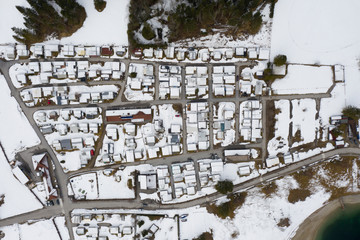 birds eye view to small camping site ground at winter with snow
