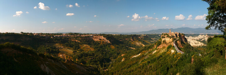 Obraz premium Picturesque panoramic sunset view of ancient italian hilltop town of Civita di Bagnoregio, known as the 