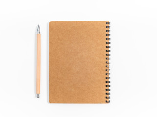 Brown spiral notebook isolated on white background.top view