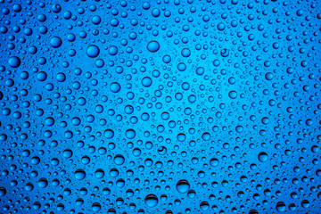 Drops pattern rain. Wet water on window glass. Bubble background.