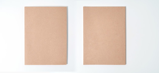 Brown spiral notebook isolated on white background.top view