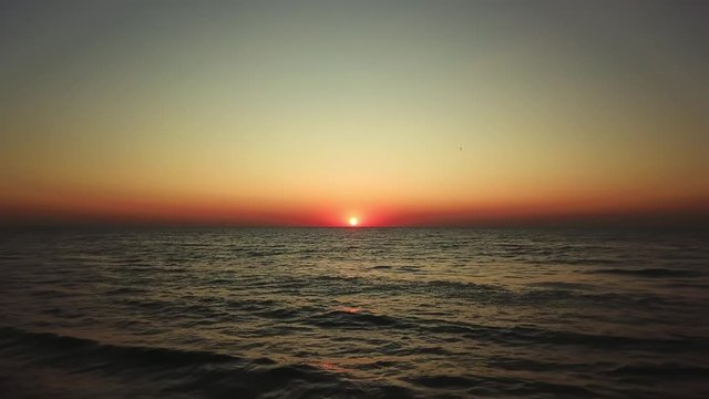 aerial view of Sunrise over sea, Beautiful sunrise Ocean, morning wawes on the sea, Beautiful reflections on water surface at sunrise, Sunrise above sea 