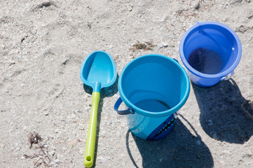 Topview, close distance of a Childs plastic shovel and two blue, 