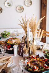 Beautiful wedding table decoration and decor in boho or rustic style