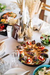 Beautiful wedding table decoration and decor in boho or rustic style