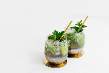Cocktail with lime, mint and ice. Summer drinks.