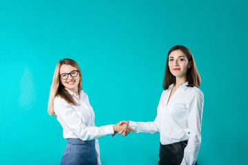 business woman shaking hands, concept close deal or partnership. Two women partners handshaking after signing business contract. Closing the deal. Congrats concept