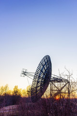 radio telescope dish satellite equipment at sunset landscape