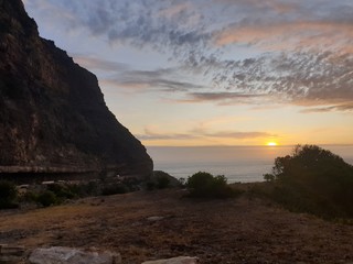 sunset on coast of sea