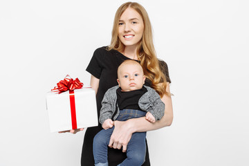 Happy smiling mother and child with gift box on white background