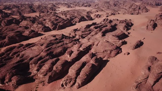 Slow drone flight past boulders in deserts of Al Ula region in Saudi Arabia