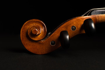 Violin scroll isolated on a black background