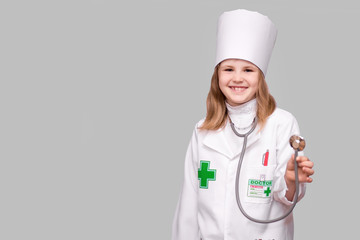 Little girl wearing in medical uniform with stethoscope isolated on white. Coronavirus Quarantine Concept.