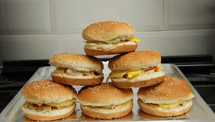 mountain of ready-made cheeseburgers and burgers