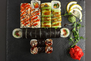 Japanese food: Set of salmon sushi and rolls with salmon and eel
